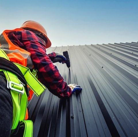 worker-man-building-tradesman-roof-house-with-safety-helmet_130181-1157